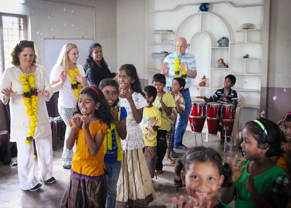 Group of young girls dancing for home visitors