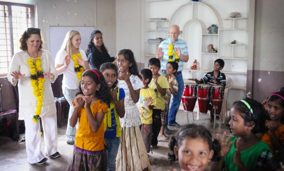 Group of young girls dancing for home visitors