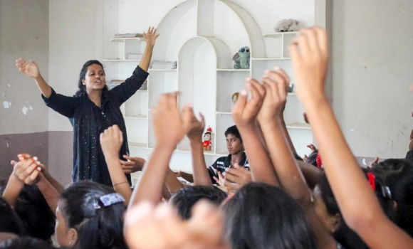 Rosie Thandu leads the children in an activity at the Children of Faith Home