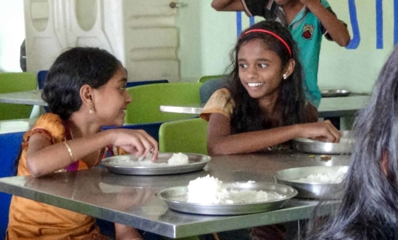 Two girls chatting and enjoying lunch