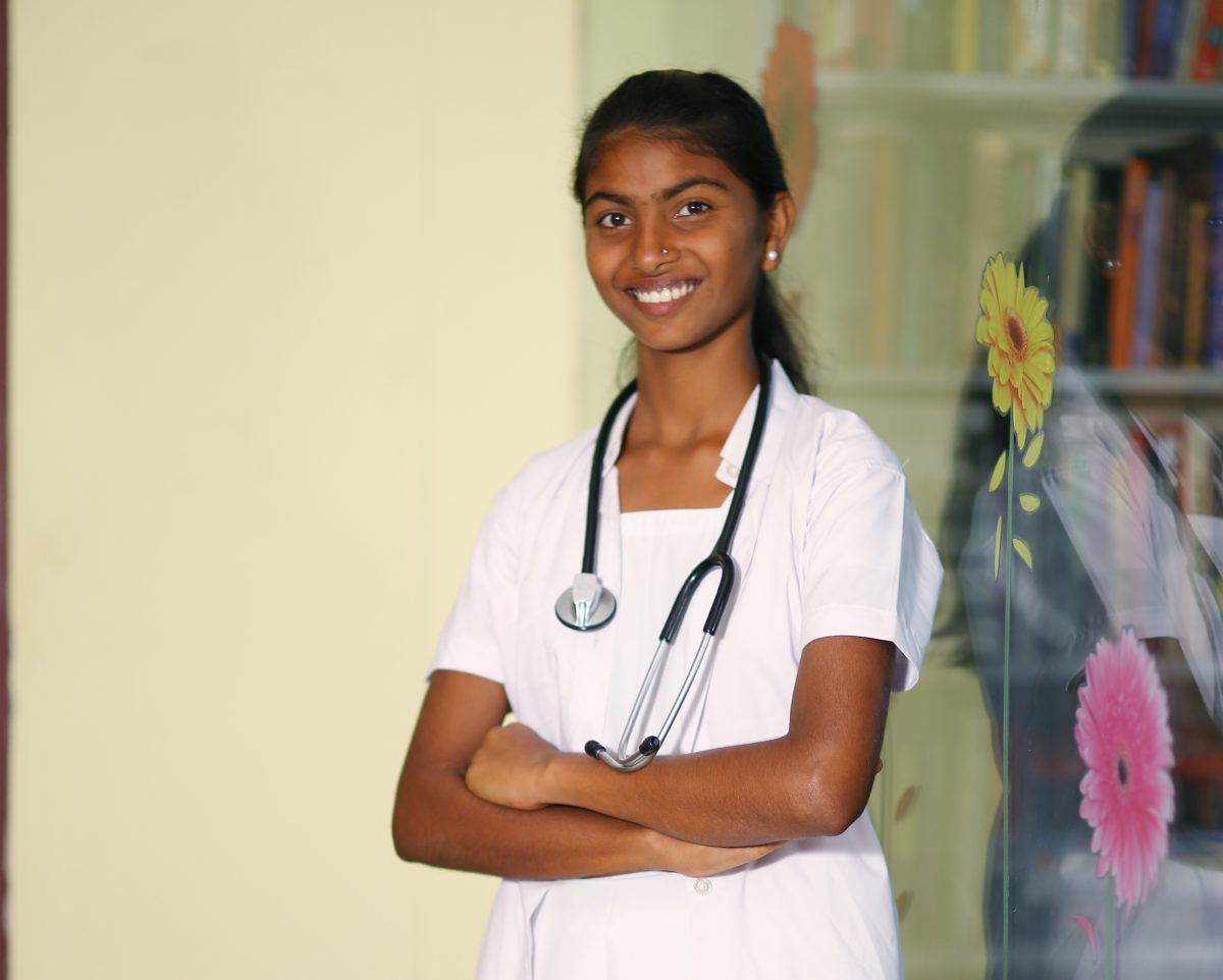 a young woman in a white nurses uniform