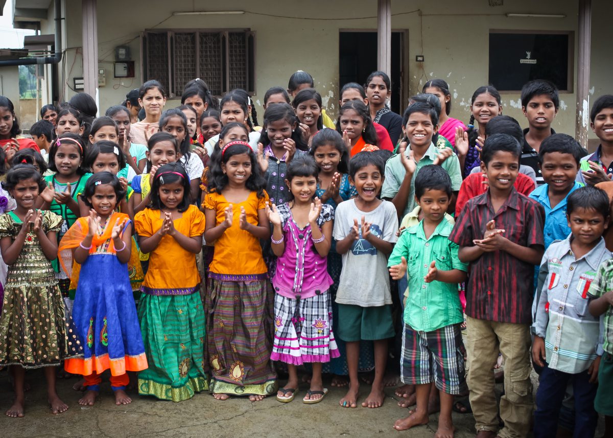 all the children from Children of Faith gather to wave and welcome visitors