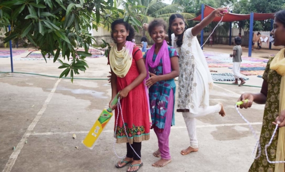 group of girls with jump rope and cricket bat