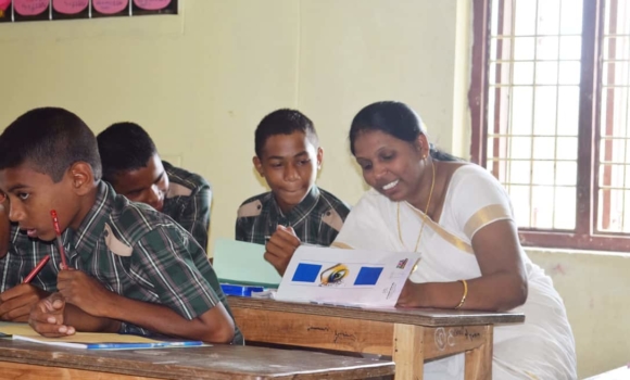 student in home school getting help from teacher