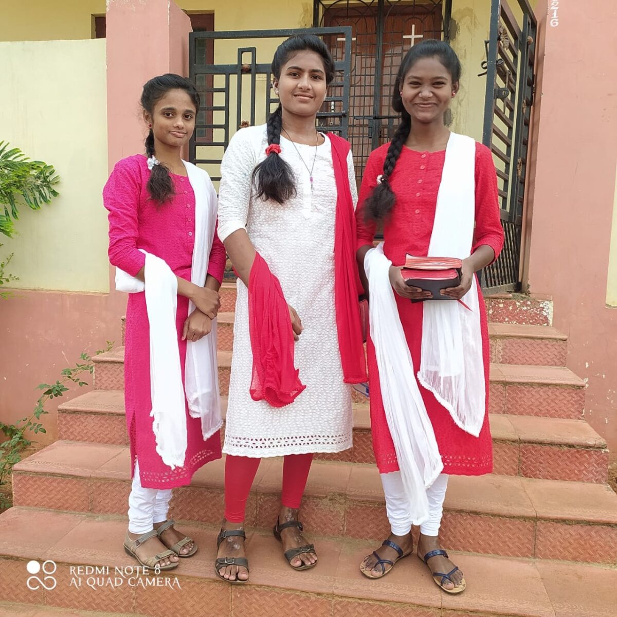 Author and two friends pose together in India