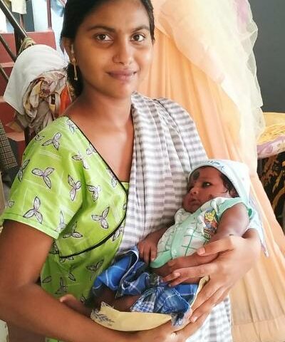 Anajali holing her new born daughter