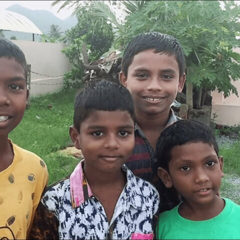 Group of boys posing for the camera before returning to the home.