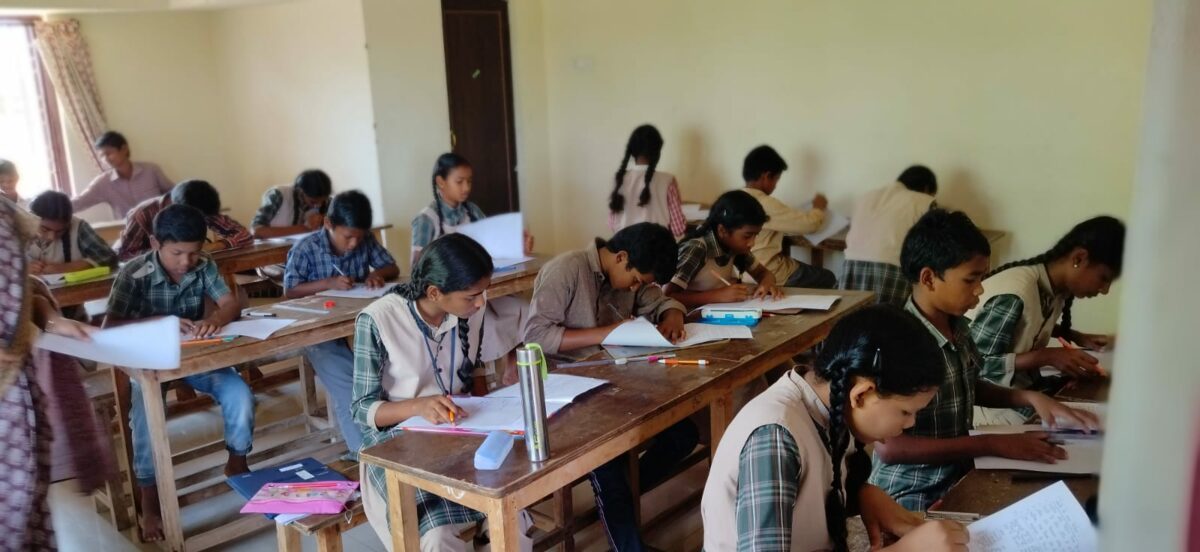 Students at work in the Home school at the Children of Faith Home in India