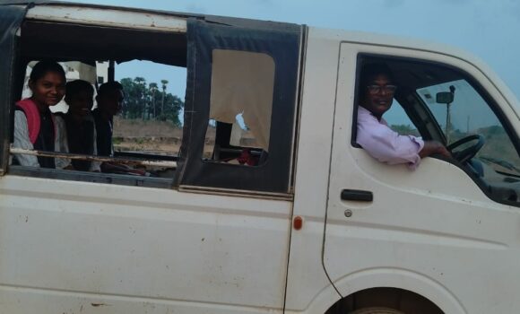 A driver in a vehicle at the Children of Faith Home in India