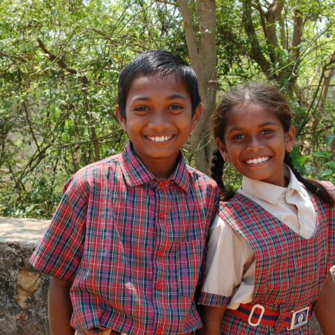 A brother and sister at Children of Faith in India