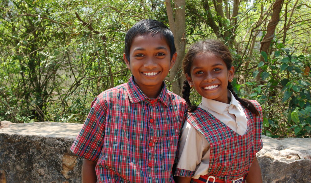 A brother and sister at Children of Faith in India