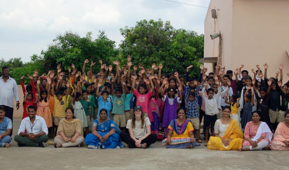 All the children pose with a visitor at the Children of Faith home in India