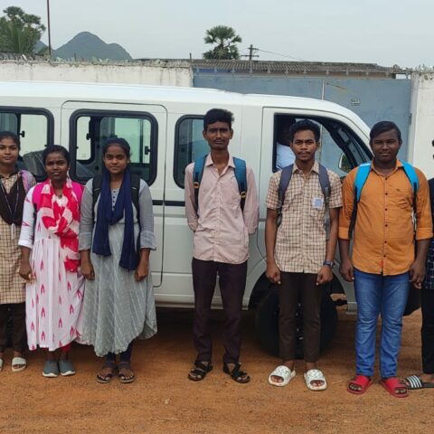 College sturdents in front of the new Tata Majic at the Children of Faith Home