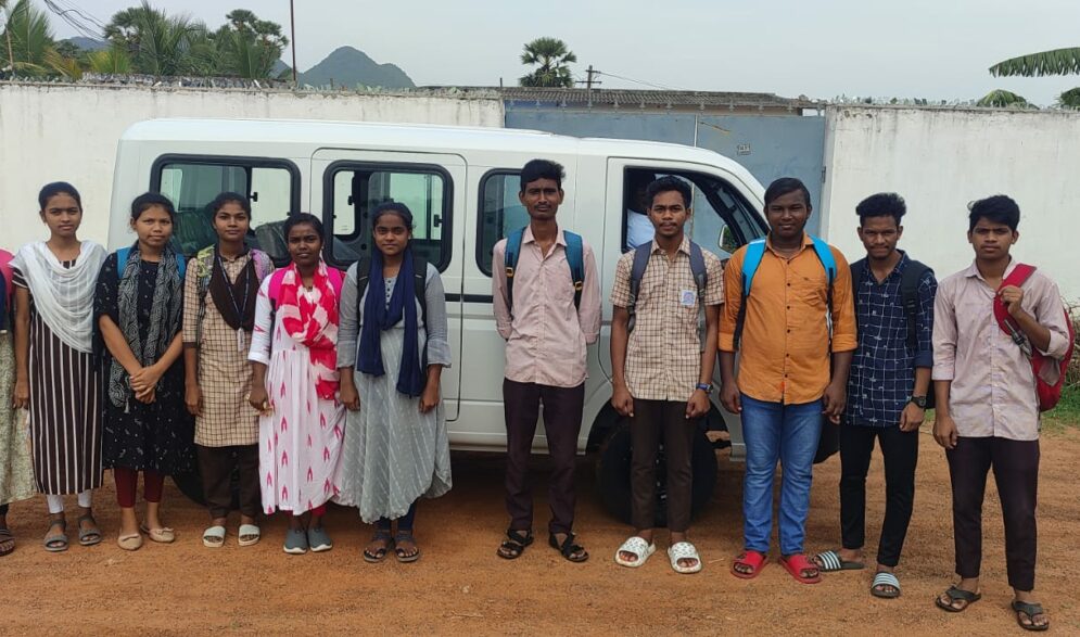 College sturdents in front of the new Tata Majic at the Children of Faith Home