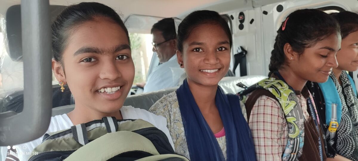 girls ride in new van at Children of Faith inIndia
