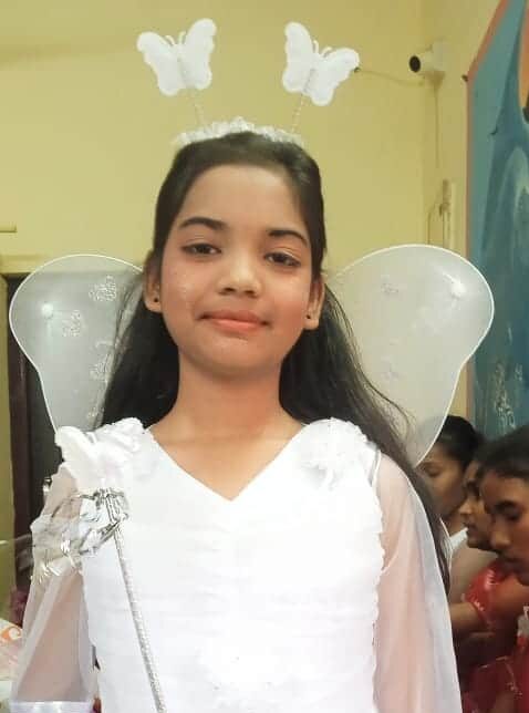 A Girl celebrating Christmas at Children of Faith in India