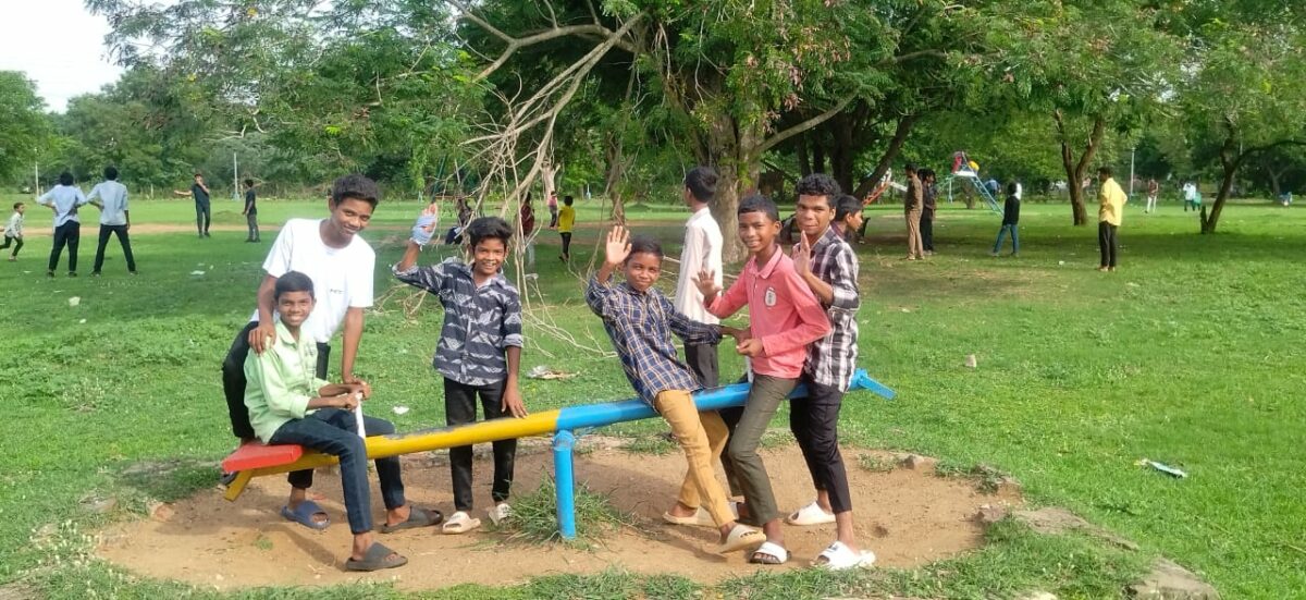 Boys form Children of Faith on a see-saw enjoying a day at the park