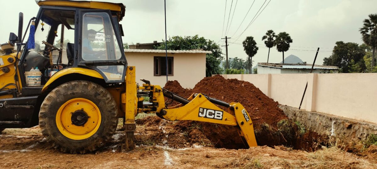 Back hoe works on modern kitchen construction at Children of Faith in India