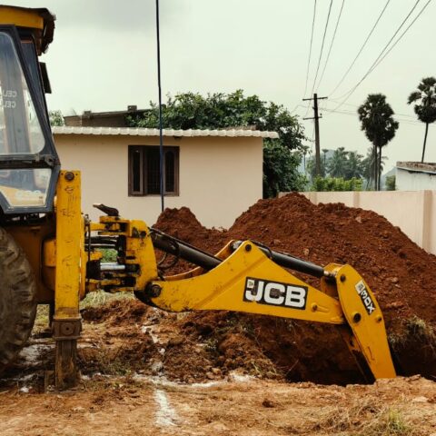 Back hoe works on modern kitchen construction at Children of Faith in India