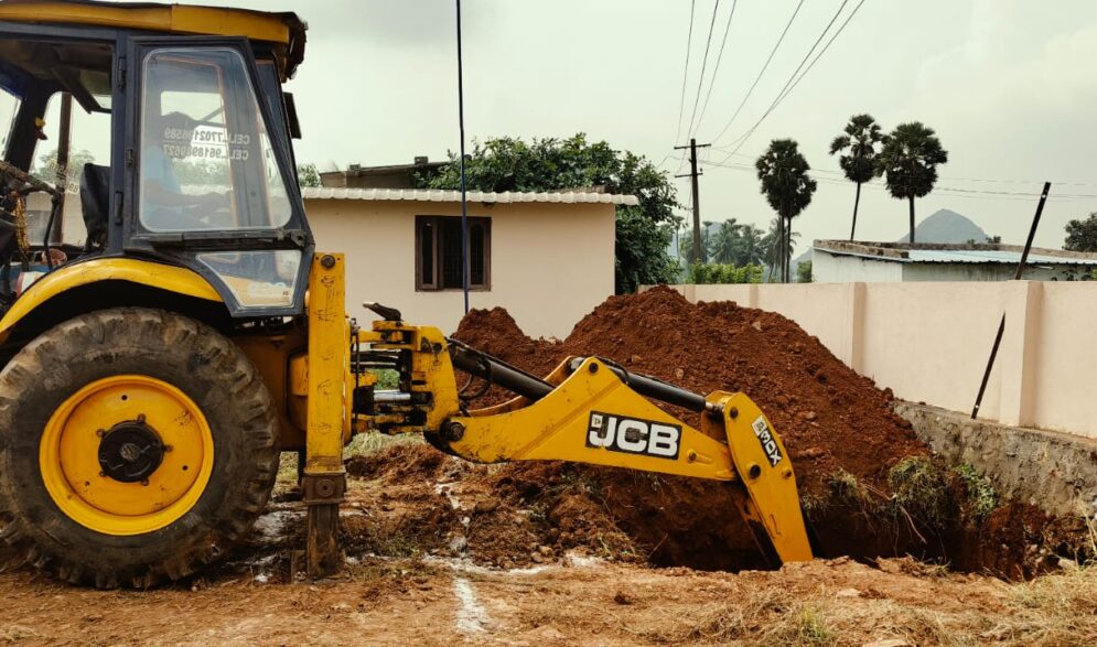 Back hoe works on modern kitchen construction at Children of Faith in India