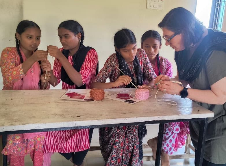 Visitor teaches knitting at Children of Faith in India