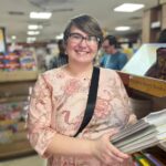 A volunteer shops for books to add to the library at the Children of Faith Home in Inida