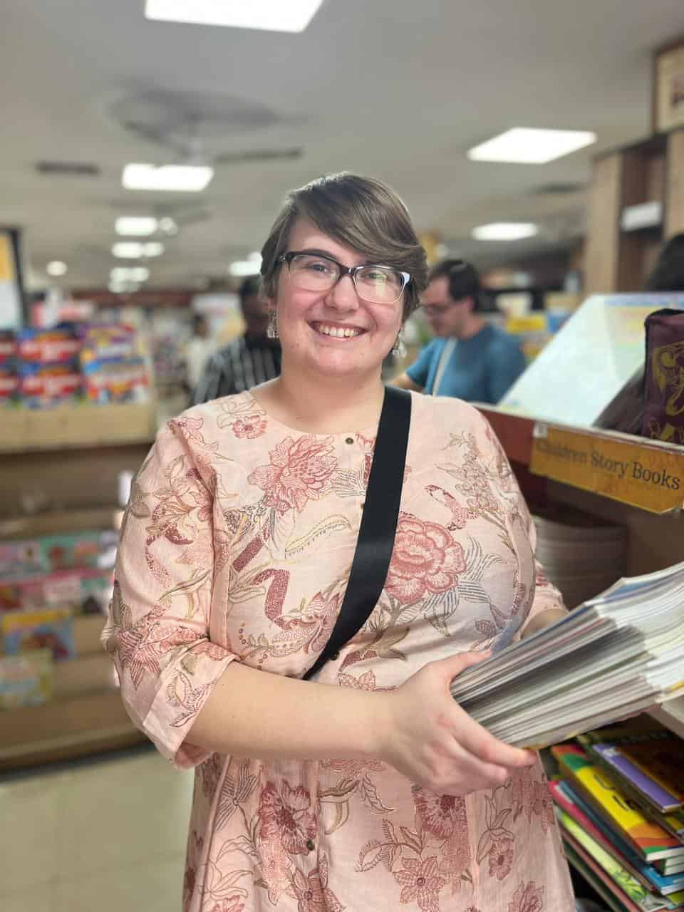 A volunteer shops for books to add to the library at the Children of Faith Home in Inida